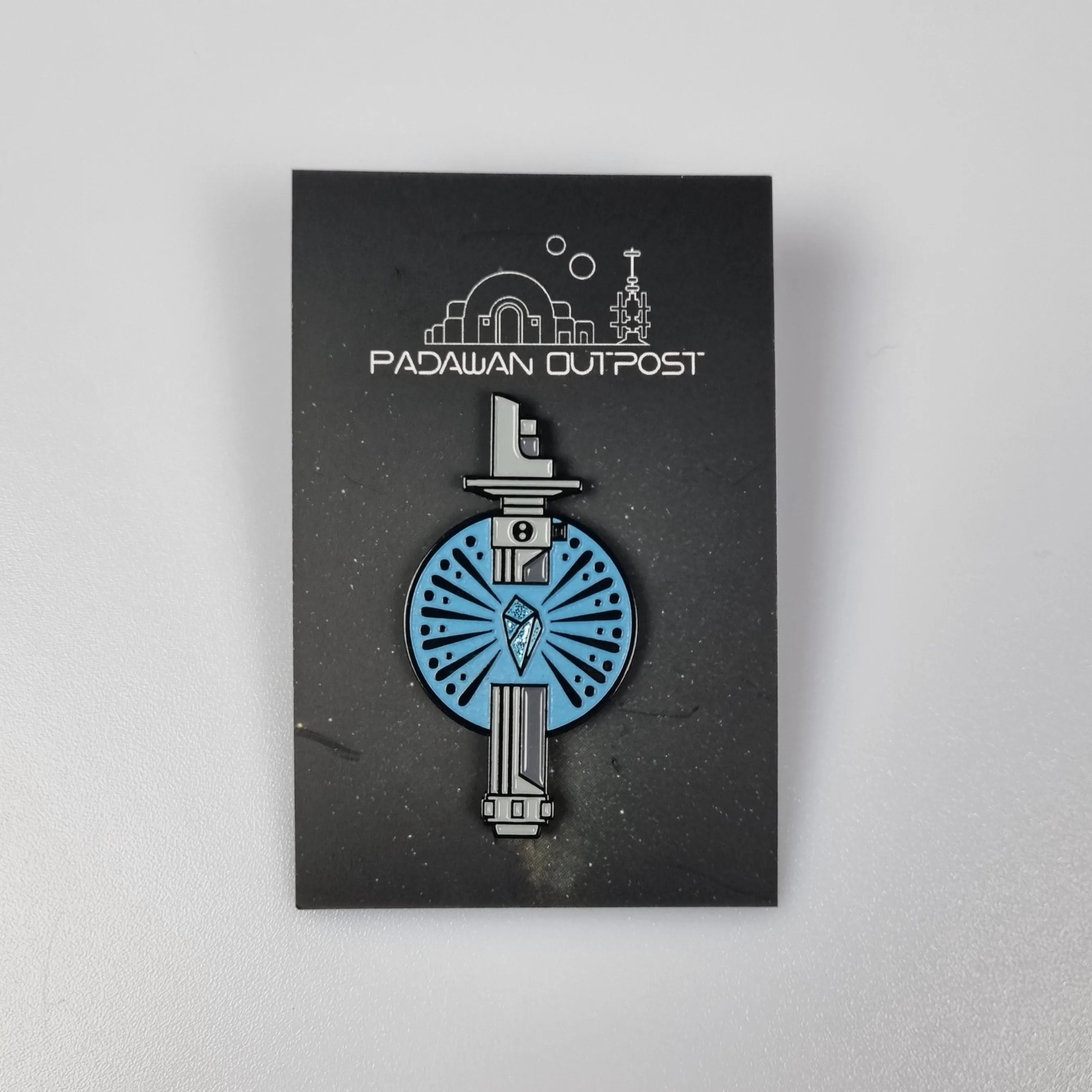 Saber crystal pin badge