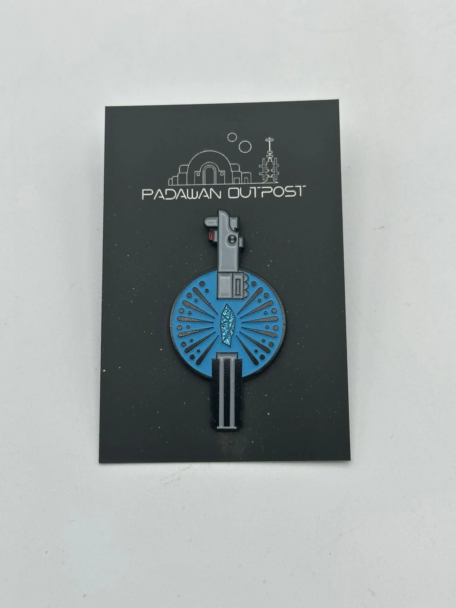 Saber crystal pin badge