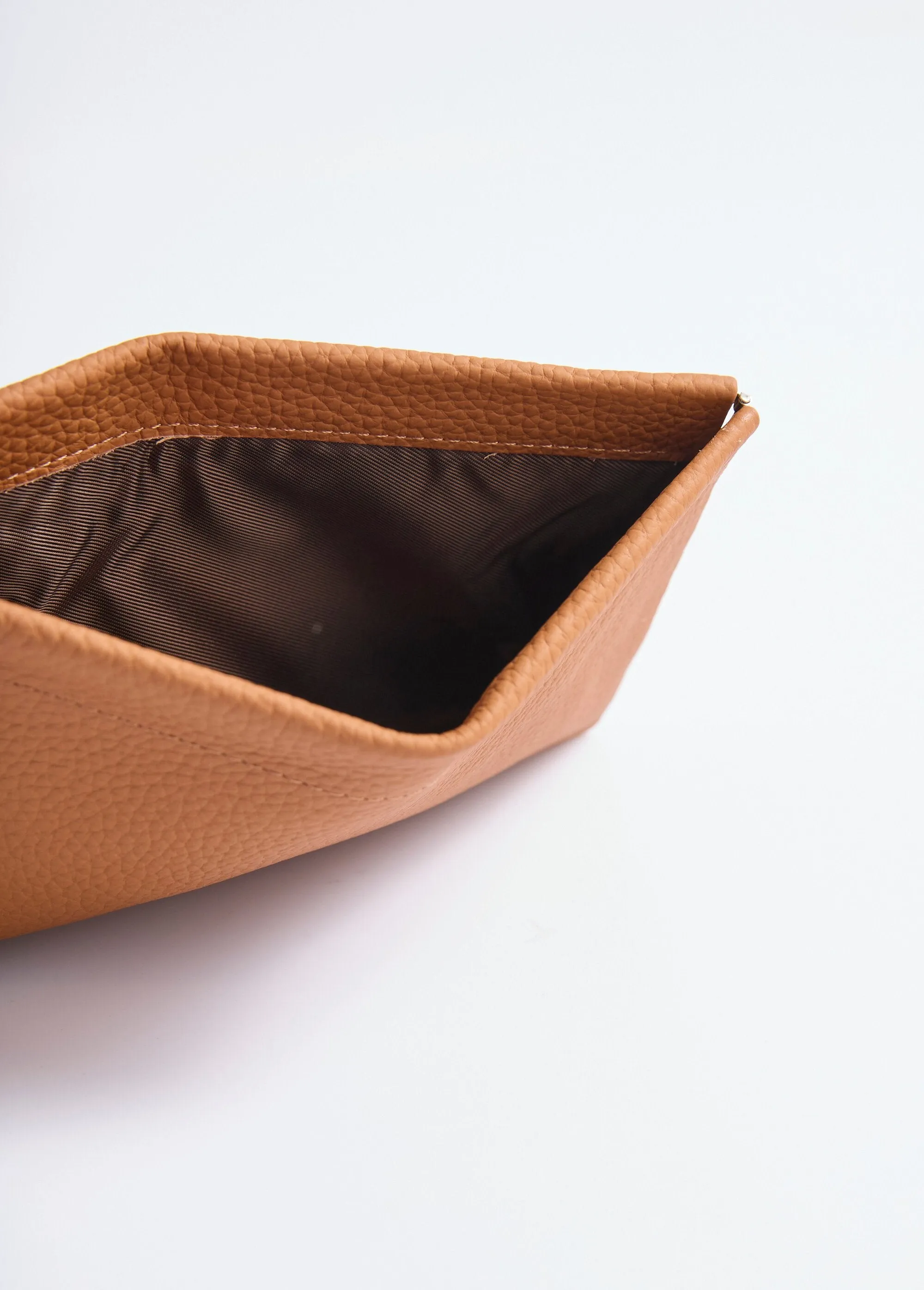Small leather pouch with rigid closure