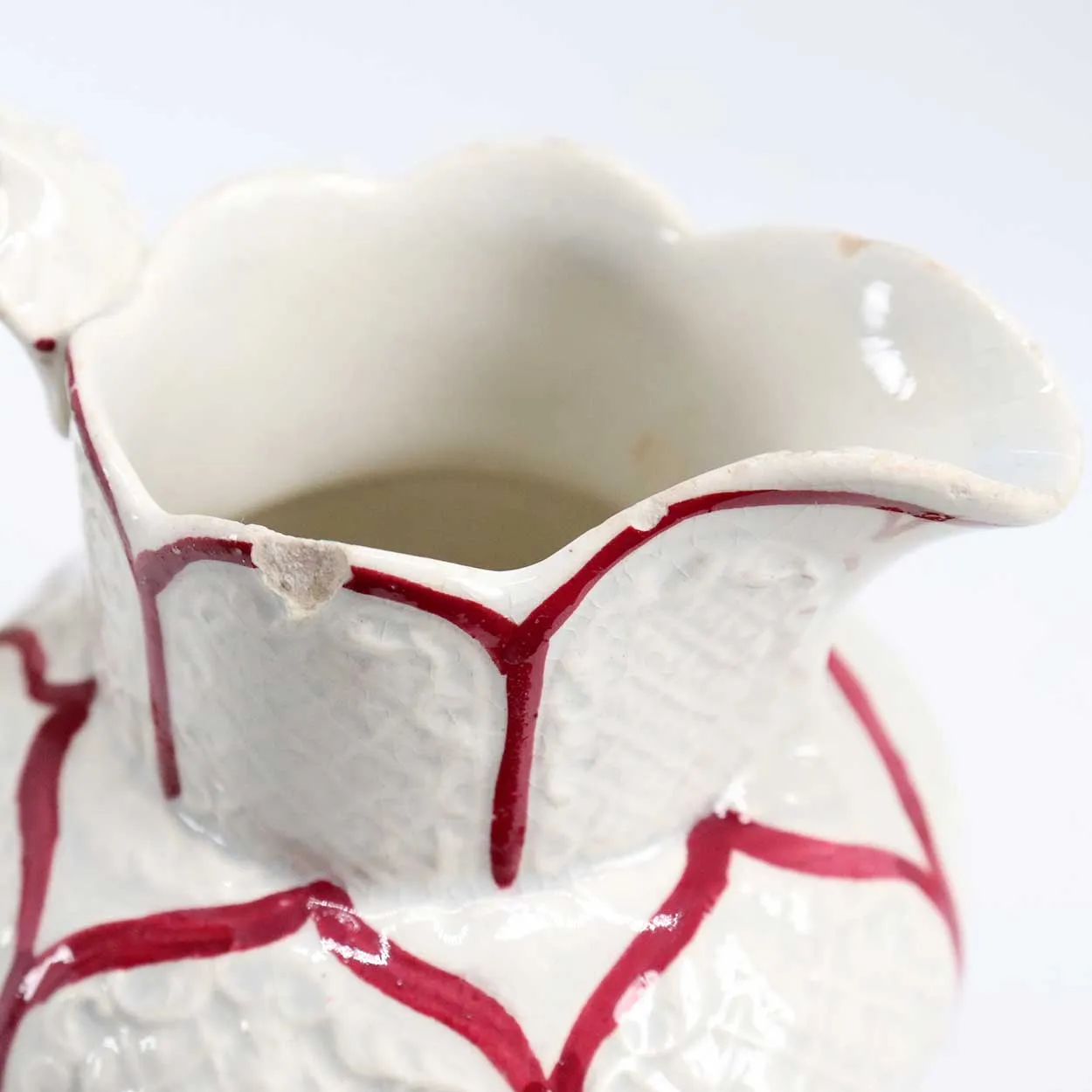 Small Moulded Pottery Red and Cream Glazed Creamer Pitcher