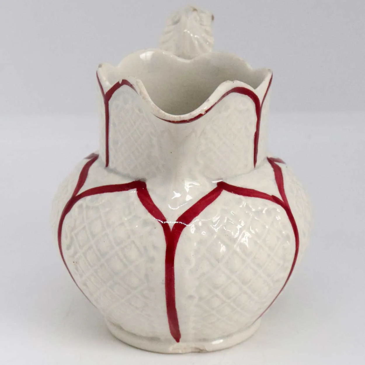 Small Moulded Pottery Red and Cream Glazed Creamer Pitcher