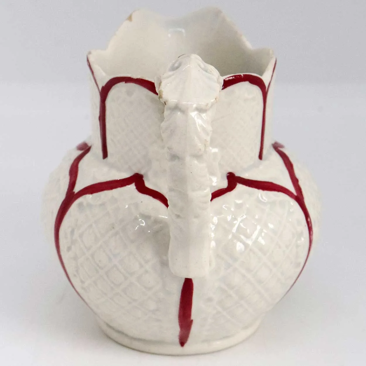 Small Moulded Pottery Red and Cream Glazed Creamer Pitcher