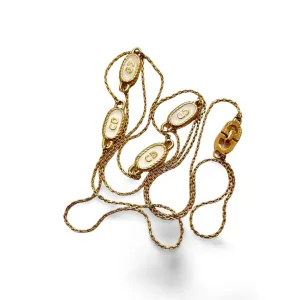 Vintage Christian Dior skinny golden chain necklace with gold and white oval CD charms. Classic Dior jewelry. Long necklace. 060130ac2